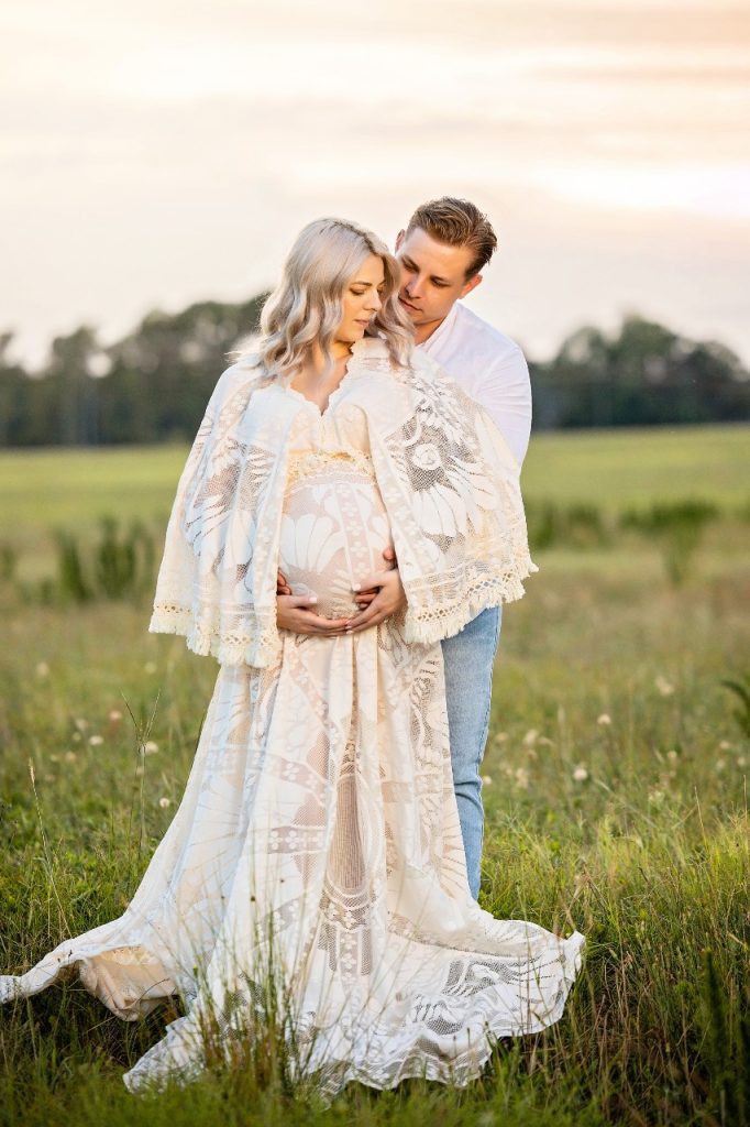 pregnant-woman-in-lace-gown-with-partner.jpg